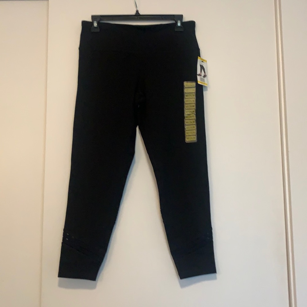 Women’s brand new Calvin Klein black medium leggings with cut out detail